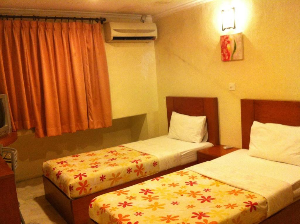 City Star Hotel Kulai Szoba fotó